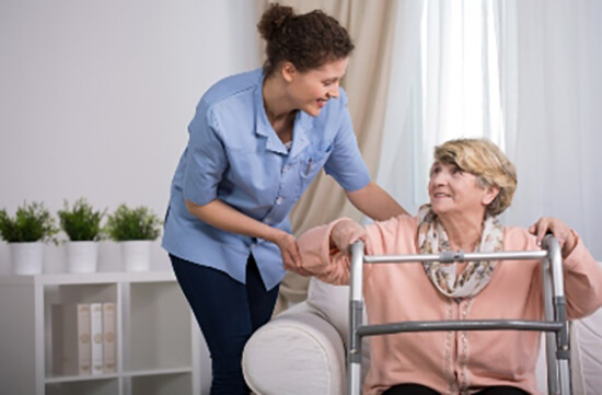 healthcare professional assisting a senior patient in her own home healthcare professional assisting a senior patient in her own home