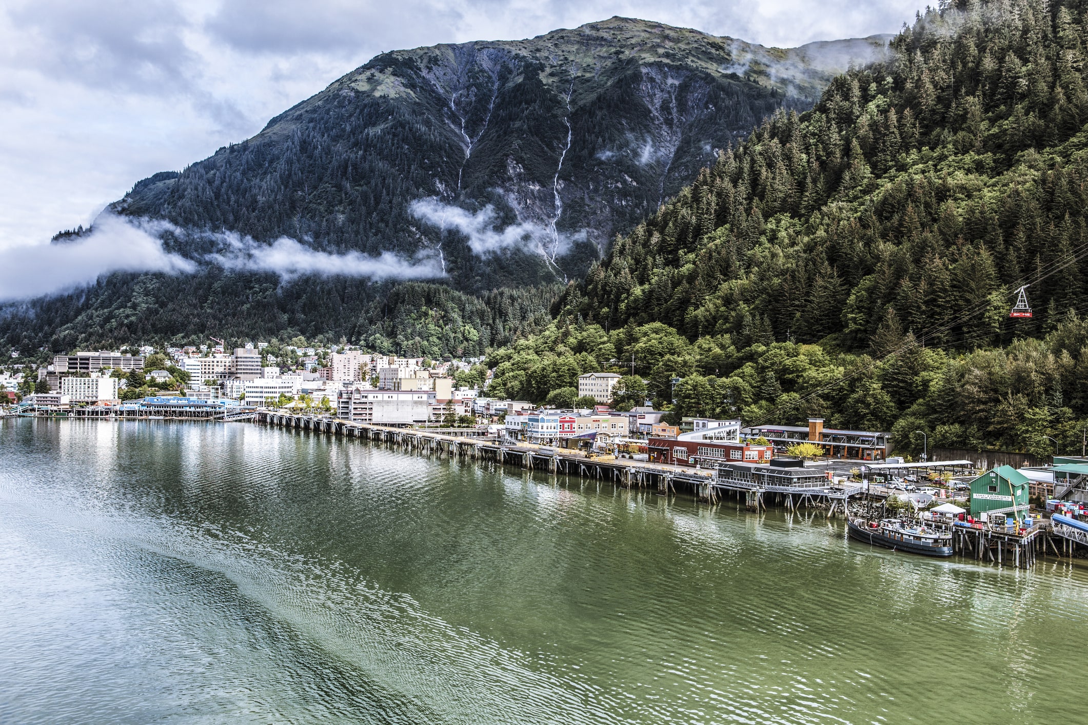 beautiful scenic view of homes in town next to water in alska beautiful scenic view of homes in town next to water in alska