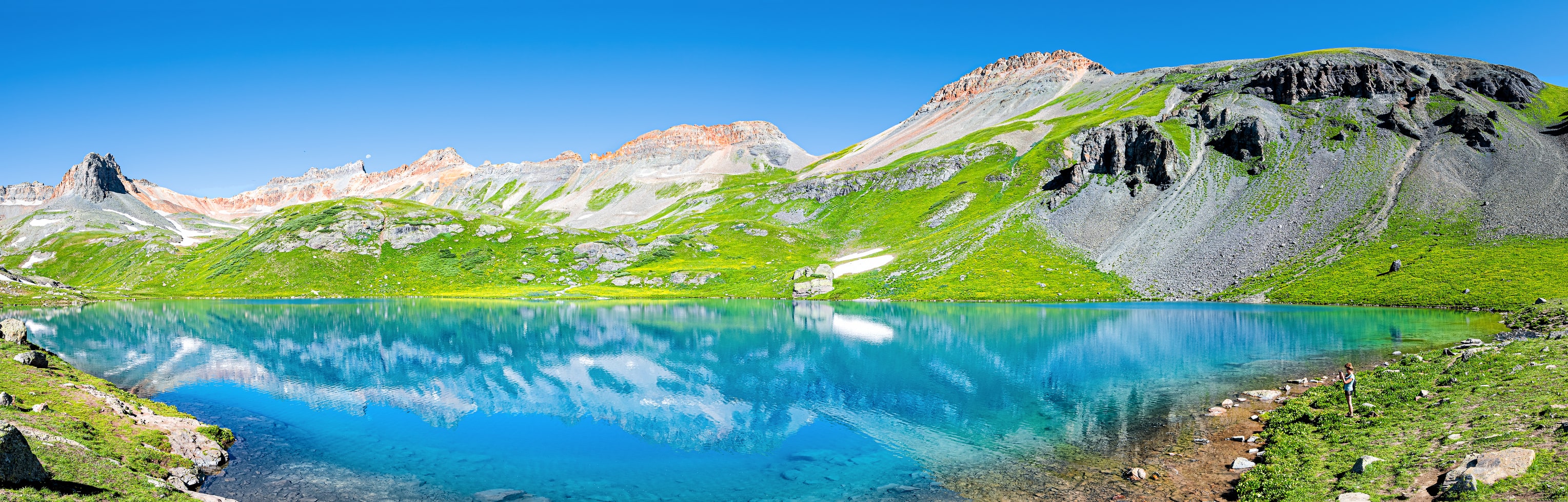 crystal blue water lake in colorado mountains