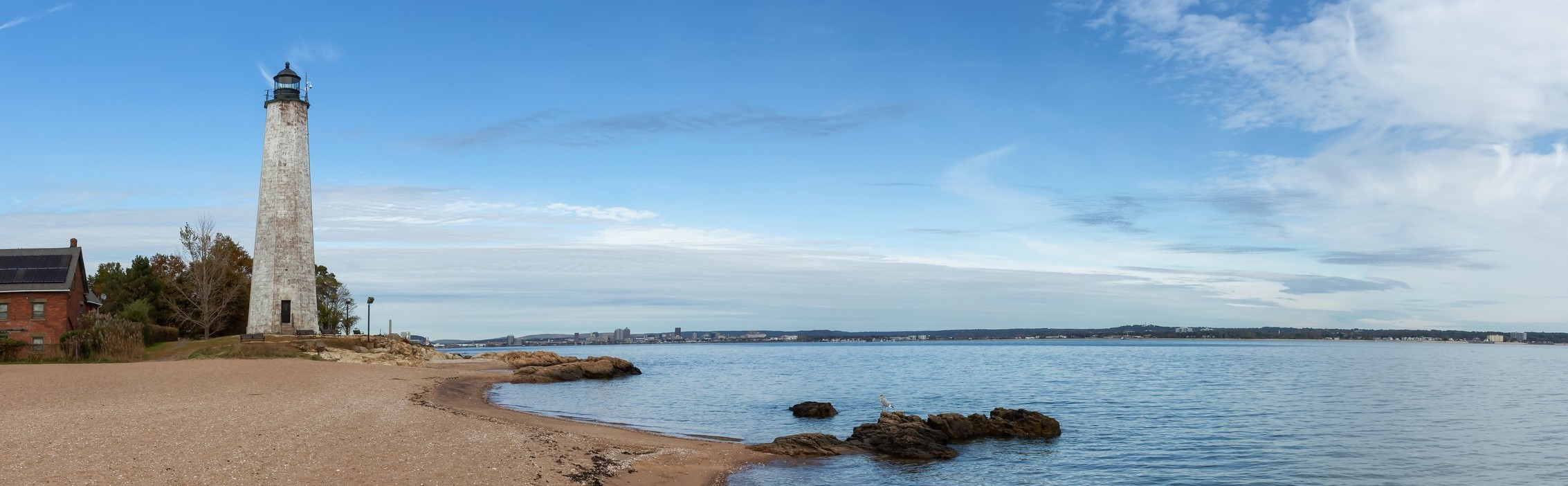 lighthouse on rocky beach in connecticut lighthouse on rocky beach in connecticut
