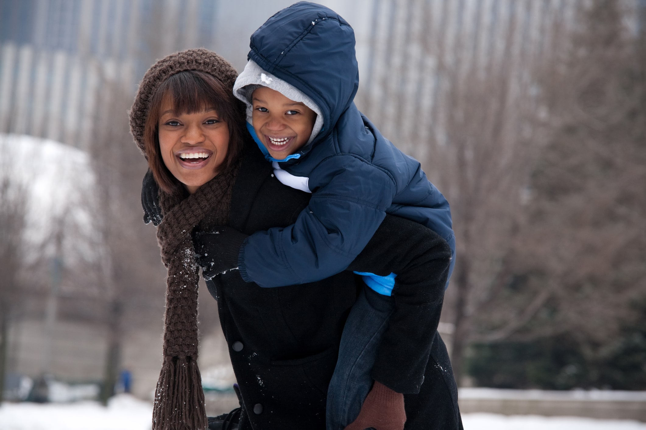 mother and son playing in snow in Illinois mother and son playing in snow in Illinois