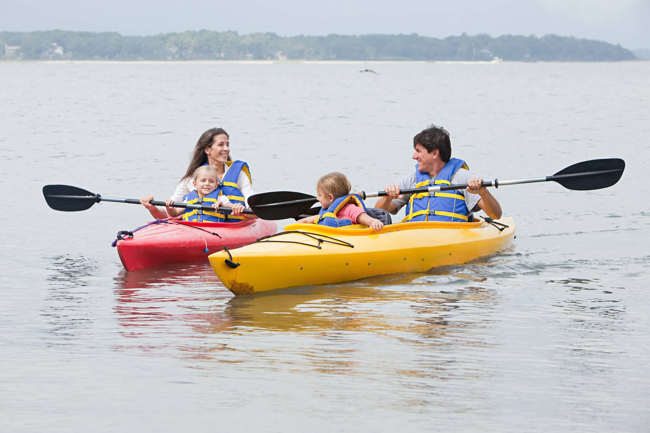 Man, woman, and child kayaking Man, woman, and child kayaking
