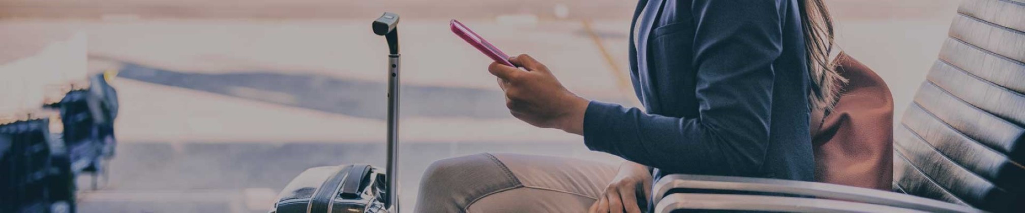 A female traveler checks her phone